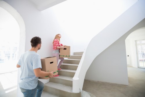 Stacked boxes and furniture representing cubic-yard pricing