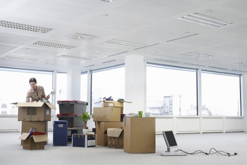 Dismantled office desks and workspace furniture prepared for transport